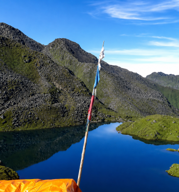 Gosaikunda Lake Trek, Holy Place with crystal-clear alpine lake and surrounding Himalayan mountains in Langtang National Park, Nepal.
